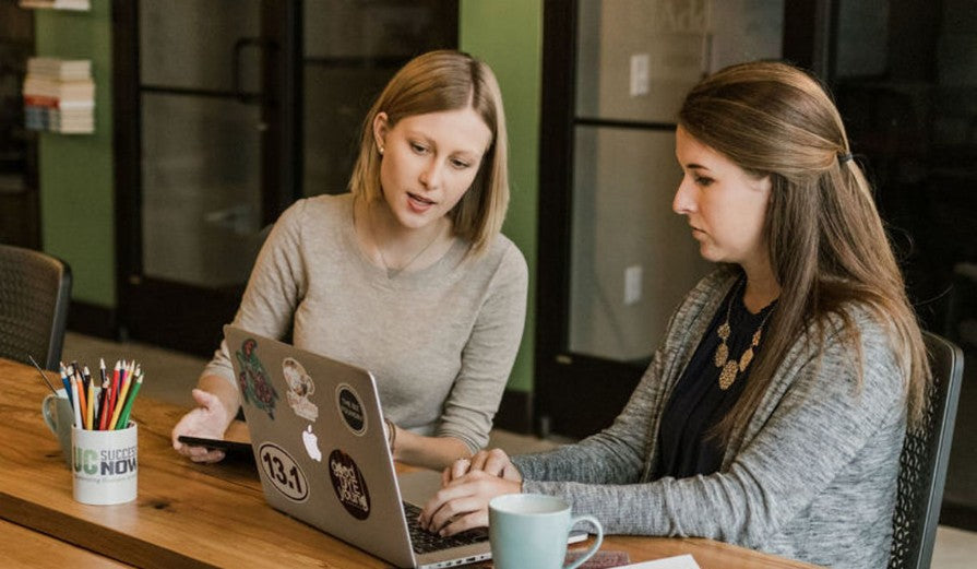 Tea Phillips and partner working at Biz Foundry