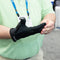 Man wearing MetaFlex Grip Strengthening Compression Glove on one hand